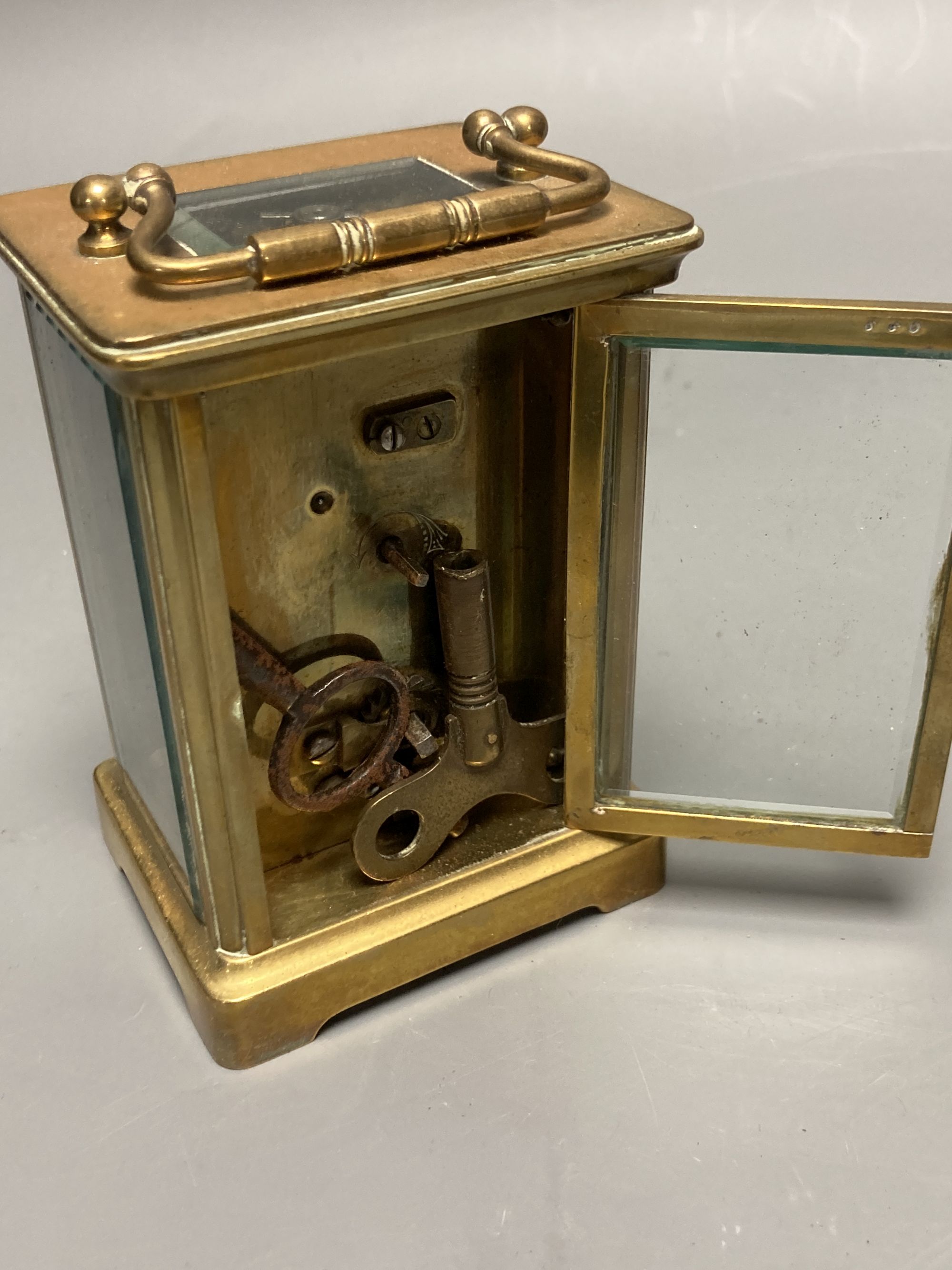 A French brass carriage timepiece, by F.L. Chandler, height 11cm, box 13cm